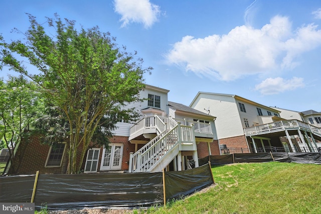 4788 Charter Ct, Woodbridge, VA 22192 - back of property with brick siding, stairway, and a wooden deck