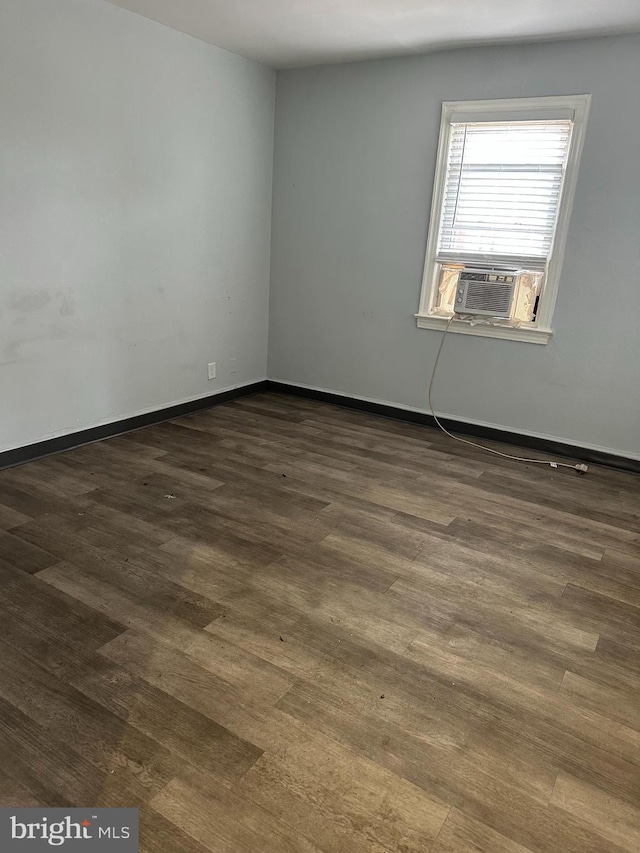 248 Hamilton NW, Washington, DC 20011 - empty room with cooling unit, dark wood-style floors, and baseboards