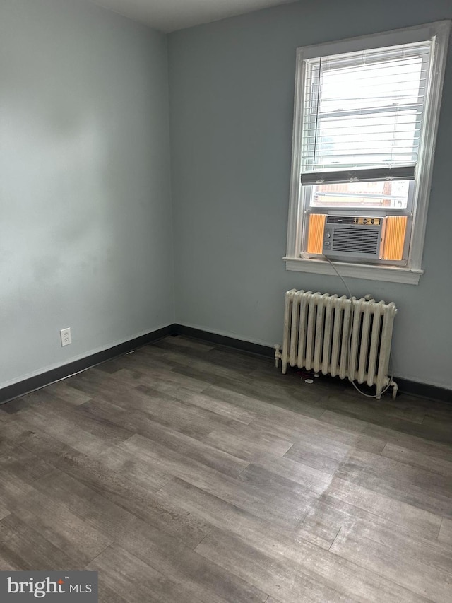 248 Hamilton NW, Washington, DC 20011 - empty room with radiator heating unit, wood finished floors, and baseboards