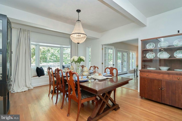 37193 Adams Green Ln, Middleburg, VA 20117 - dining area with light wood-type flooring, a chandelier, beam ceiling, and healthy amount of natural light