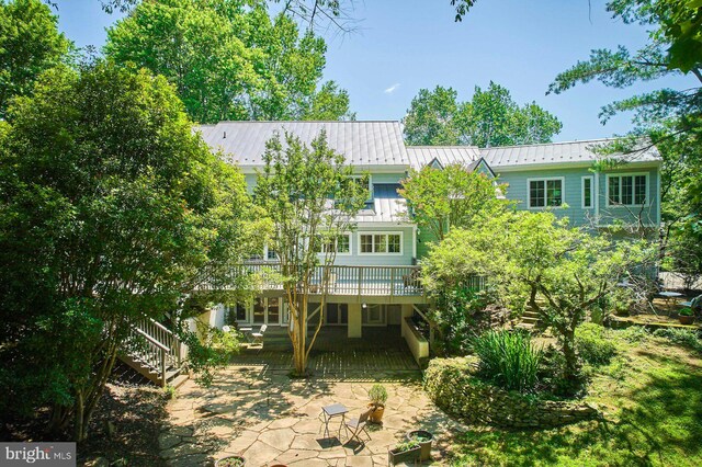 37193 Adams Green Ln, Middleburg, VA 20117 - back of property with stairs, a patio area, a deck, a metal roof, and a standing seam roof