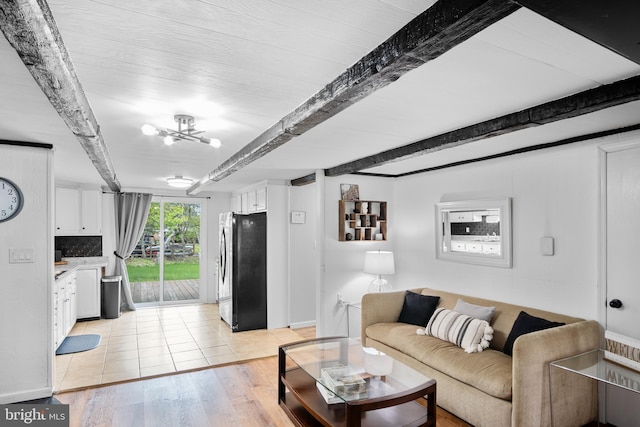 109 Knob Ct, Albrightsville, PA 18210 - living room featuring beam ceiling, light wood-style floors, a chandelier, and baseboards