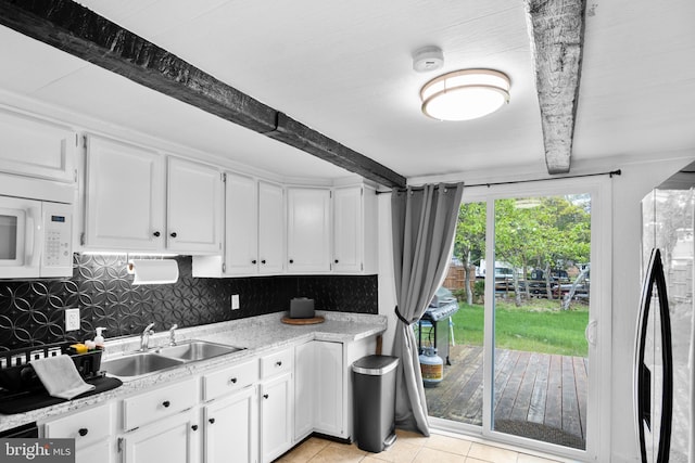 109 Knob Ct, Albrightsville, PA 18210 - kitchen with a sink, beamed ceiling, white cabinets, white microwave, and light countertops