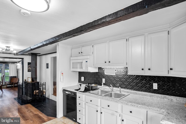109 Knob Ct, Albrightsville, PA 18210 - kitchen with black dishwasher, white microwave, a sink, tasteful backsplash, and white cabinetry