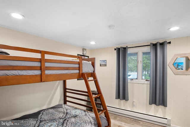 109 Knob Ct, Albrightsville, PA 18210 - bedroom with baseboard heating, wood finished floors, and recessed lighting