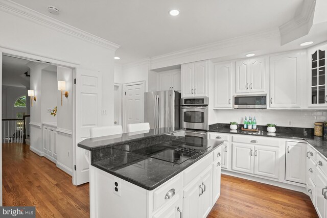 6638 Hampton View Pl, Mclean, VA 22101 - kitchen with stainless steel appliances, ornamental molding, light wood-type flooring, glass insert cabinets, and white cabinets