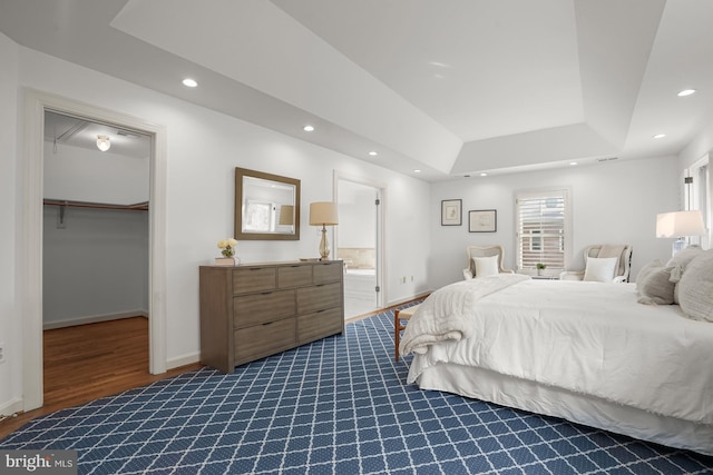 6638 Hampton View Pl, Mclean, VA 22101 - bedroom with recessed lighting, a spacious closet, dark wood-type flooring, a raised ceiling, and baseboards