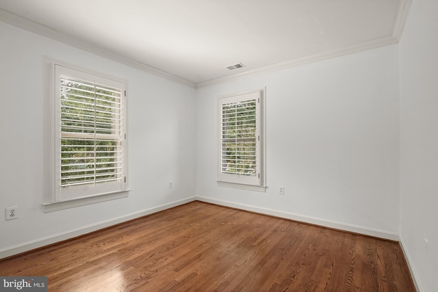 6638 Hampton View Pl, Mclean, VA 22101 - spare room featuring crown molding, healthy amount of natural light, wood finished floors, and baseboards