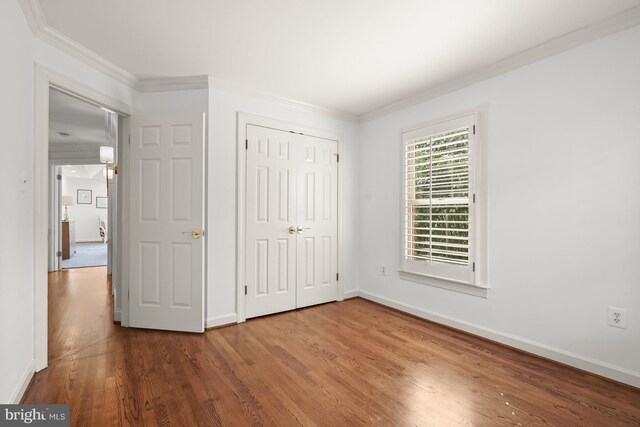 6638 Hampton View Pl, Mclean, VA 22101 - unfurnished bedroom with wood finished floors, crown molding, baseboards, and a closet