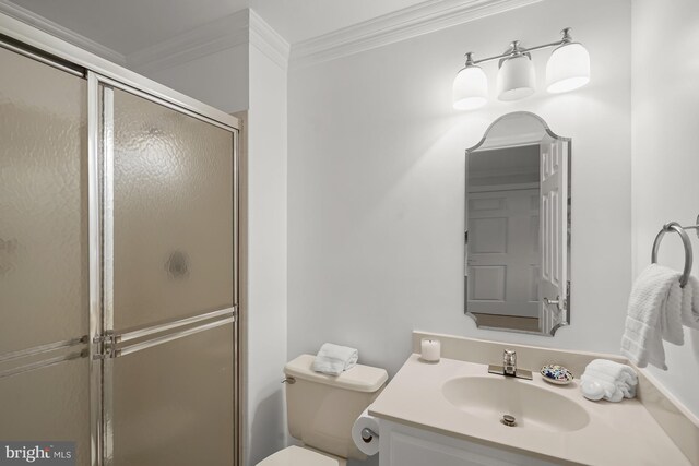 6638 Hampton View Pl, Mclean, VA 22101 - bathroom featuring crown molding, toilet, vanity, and a shower with door