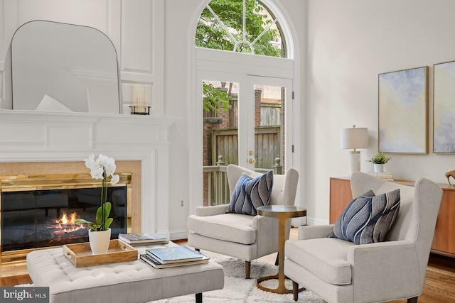 6638 Hampton View Pl, Mclean, VA 22101 - sitting room featuring a glass covered fireplace and wood finished floors