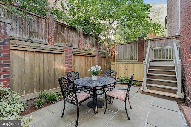 6638 Hampton View Pl, Mclean, VA 22101 - fenced backyard with outdoor dining area, a patio, and stairway