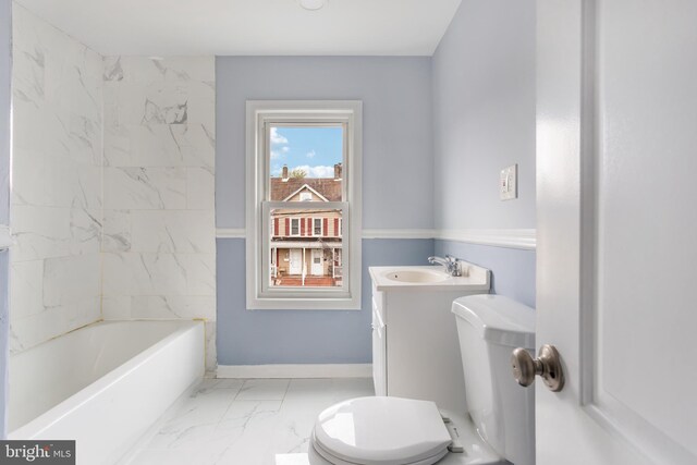 213 Franklin St, Hightstown, NJ 08520 - bathroom featuring toilet, marble look tile flooring, a bathtub, and vanity