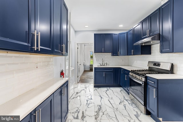 213 Franklin St, Hightstown, NJ 08520 - kitchen featuring stainless steel gas stove, under cabinet range hood, blue cabinetry, a sink, and light marble finish flooring