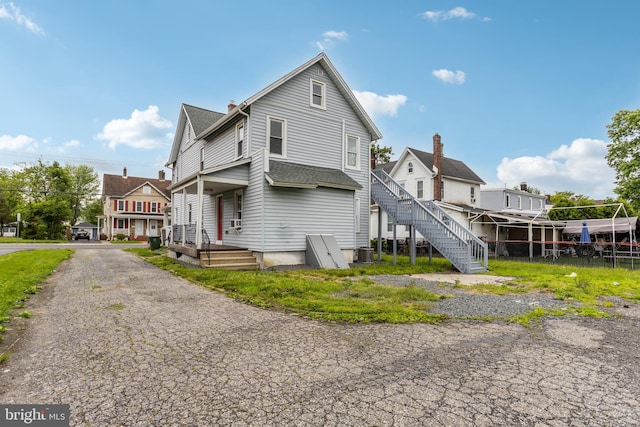 213 Franklin St, Hightstown, NJ 08520 - view of side of property with cooling unit and roof with shingles