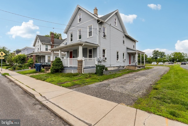 213 Franklin St, Hightstown, NJ 08520 - view of front of home with covered porch and a chimney