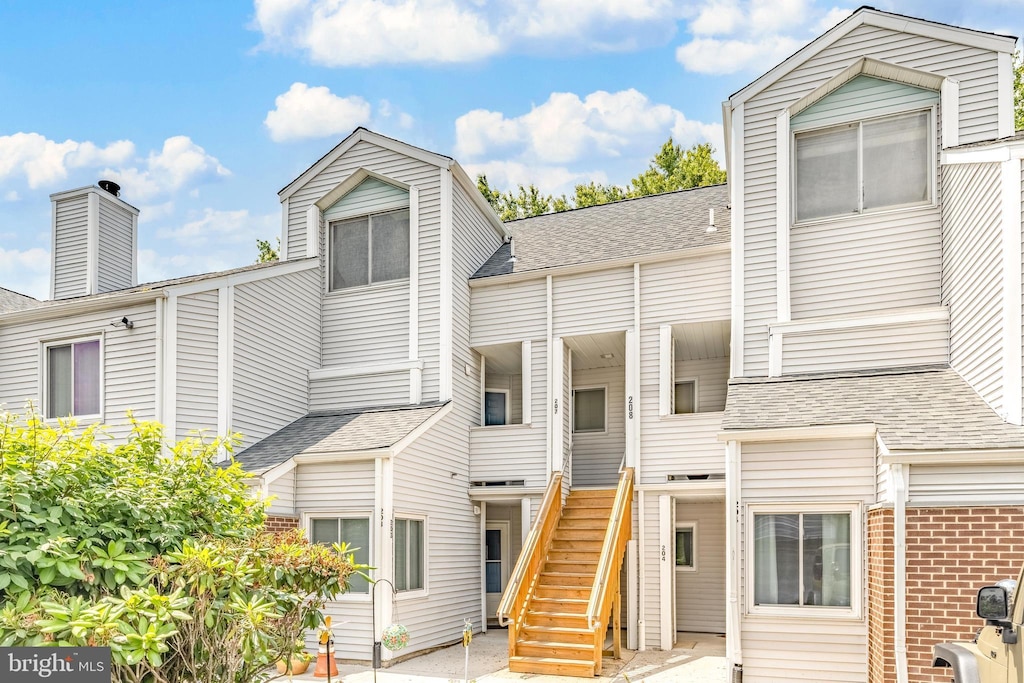 207 Michelle Ct, Newark, DE 19711 - view of front of home featuring stairway and roof with shingles