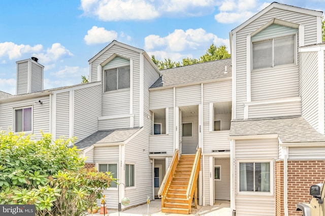 207 Michelle Ct, Newark, DE 19711 - view of front of home featuring stairway and roof with shingles