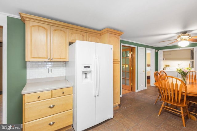 3 Cove Ct, Stafford, VA 22554 - kitchen with white fridge with ice dispenser, light brown cabinetry, light countertops, crown molding, and decorative backsplash