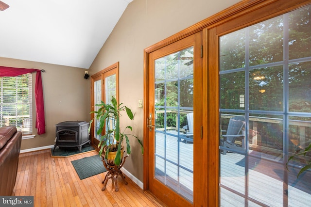 3 Cove Ct, Stafford, VA 22554 - entryway featuring a wood stove, vaulted ceiling, baseboards, and hardwood / wood-style flooring