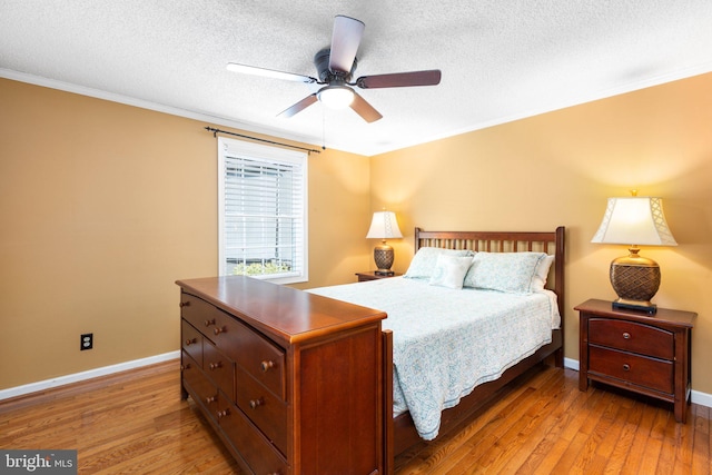 3 Cove Ct, Stafford, VA 22554 - bedroom featuring light wood-style flooring, baseboards, a textured ceiling, crown molding, and ceiling fan