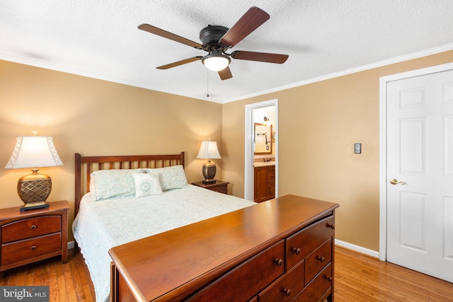 3 Cove Ct, Stafford, VA 22554 - bedroom featuring light wood-style floors, ornamental molding, a textured ceiling, baseboards, and connected bathroom