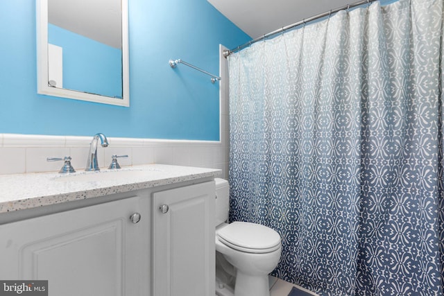 3 Cove Ct, Stafford, VA 22554 - bathroom with toilet, tile walls, vanity, wainscoting, and curtained shower