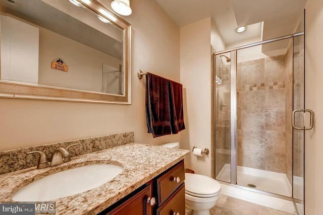 608 S Washington St, Baltimore, MD 21231 - bathroom with toilet, vanity, a shower stall, recessed lighting, and tile patterned flooring