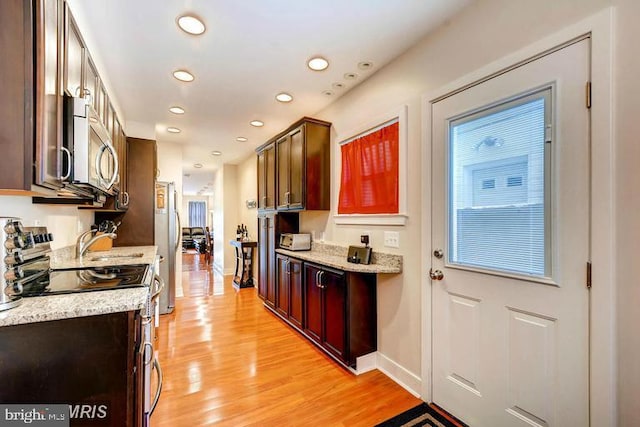 608 S Washington St, Baltimore, MD 21231 - kitchen featuring stainless steel appliances, light wood-type flooring, recessed lighting, baseboards, and dark brown cabinetry