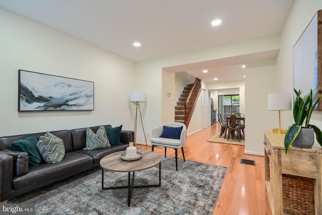 106 W Montgomery St, Baltimore, MD 21230 - living area with stairs, light wood finished floors, and recessed lighting