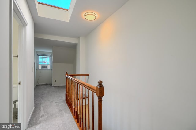 106 W Montgomery St, Baltimore, MD 21230 - hall with an upstairs landing, carpet flooring, and a skylight