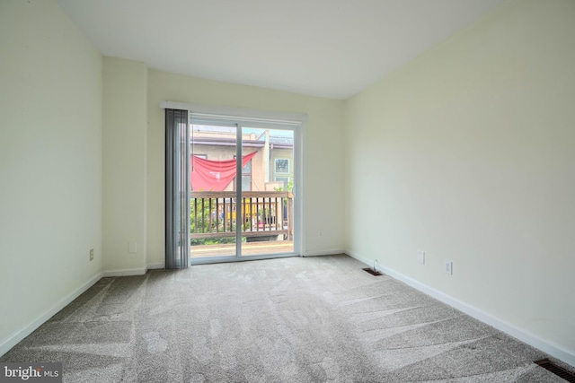 106 W Montgomery St, Baltimore, MD 21230 - spare room with carpet flooring and baseboards