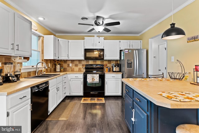404 Clover Rd, Etters, PA 17319 - kitchen featuring black appliances, a sink, blue cabinets, light countertops, and dark wood-style flooring
