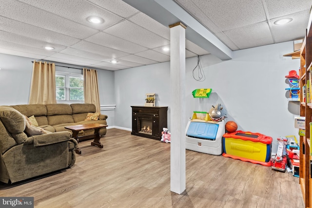 404 Clover Rd, Etters, PA 17319 - living room featuring a drop ceiling, wood finished floors, a glass covered fireplace, recessed lighting, and baseboards