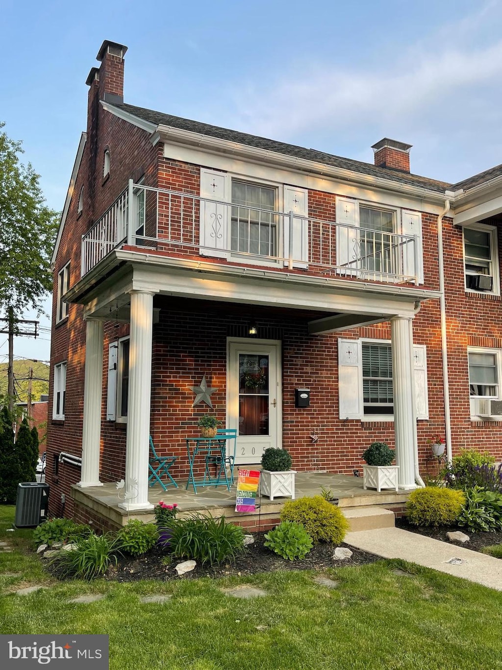 205 Endlich Ave, Reading, PA 19606 - view of front of home featuring a balcony, a chimney, covered porch, and brick siding