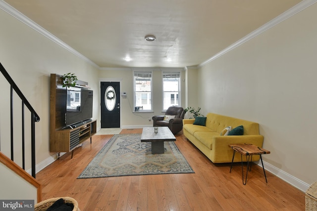 452 Fitzgerald St, Philadelphia, PA 19148 - living area featuring crown molding, light wood-style flooring, and stairs