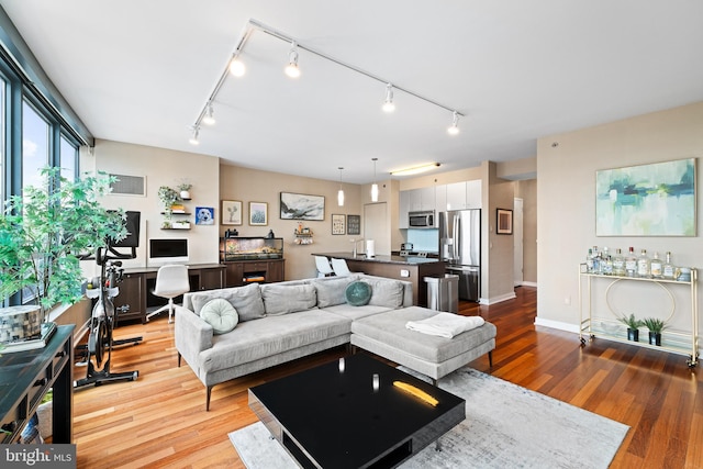 2101 Market St Unit 1104, Philadelphia, PA 19103 - living area with track lighting and wood finished floors