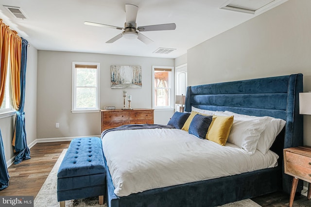 726 Harmony Orchard Rd, Front Royal, VA 22630 - bedroom featuring multiple windows, wood finished floors, baseboards, and ceiling fan