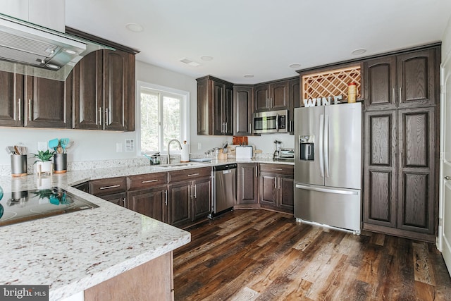 726 Harmony Orchard Rd, Front Royal, VA 22630 - kitchen featuring appliances with stainless steel finishes, a sink, dark brown cabinets, exhaust hood, and light stone countertops