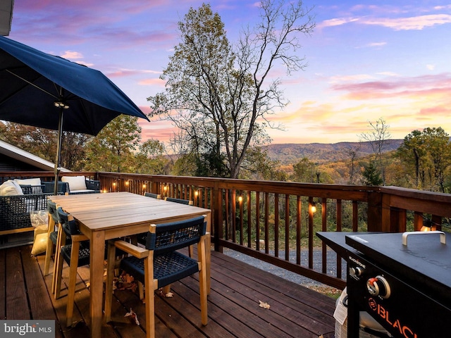 726 Harmony Orchard Rd, Front Royal, VA 22630 - deck at dusk with outdoor dining area and a mountain view