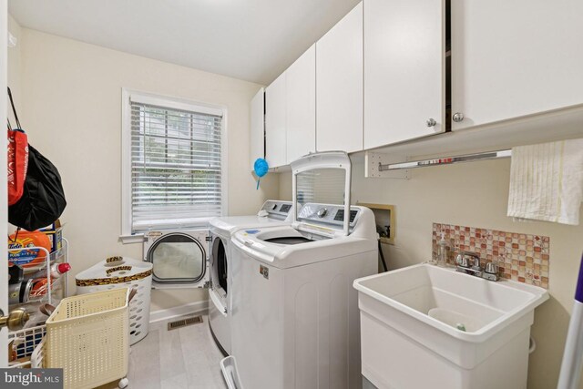 6625 Weatheford Ct, Mclean, VA 22101 - laundry area featuring washer and clothes dryer and cabinet space