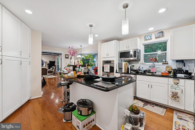 6625 Weatheford Ct, Mclean, VA 22101 - kitchen featuring stainless steel appliances, dark countertops, white cabinetry, and recessed lighting