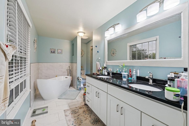 6625 Weatheford Ct, Mclean, VA 22101 - full bathroom with double vanity, a soaking tub, and marble look tile flooring