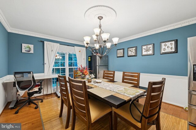 6625 Weatheford Ct, Mclean, VA 22101 - dining room featuring a chandelier, wood finished floors, and ornamental molding
