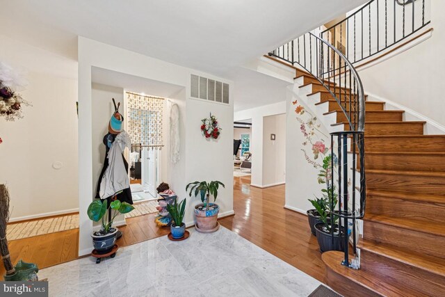 6625 Weatheford Ct, Mclean, VA 22101 - entrance foyer with stairs, baseboards, and wood finished floors
