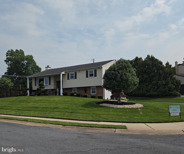 600 E 4th St, Birdsboro, PA 19508 - split foyer home featuring a front lawn and a chimney