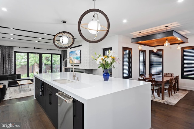 341 Hickman St, Rehoboth Beach, DE 19971 - kitchen featuring dark wood-style flooring, a sink, recessed lighting, light countertops, and a kitchen island with sink