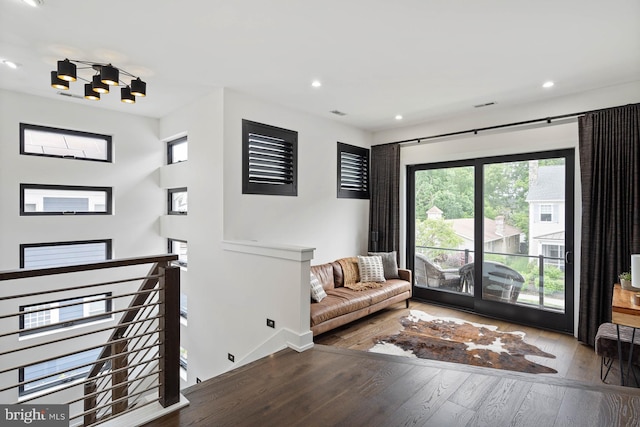 341 Hickman St, Rehoboth Beach, DE 19971 - living area featuring hardwood / wood-style floors, an upstairs landing, recessed lighting, and baseboards