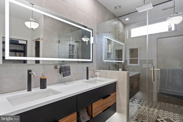341 Hickman St, Rehoboth Beach, DE 19971 - bathroom with tile walls, a shower stall, and double vanity