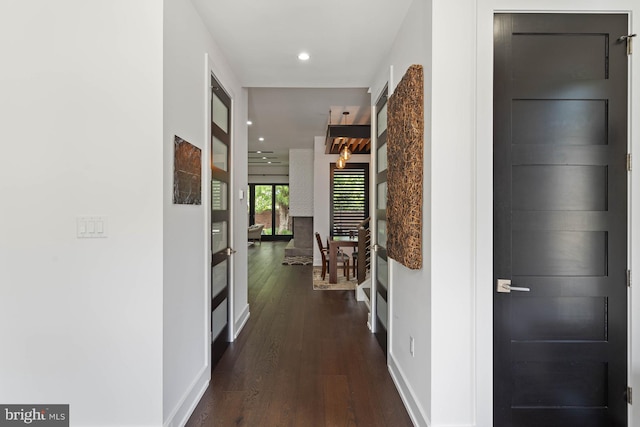 341 Hickman St, Rehoboth Beach, DE 19971 - corridor featuring dark wood finished floors, baseboards, and recessed lighting